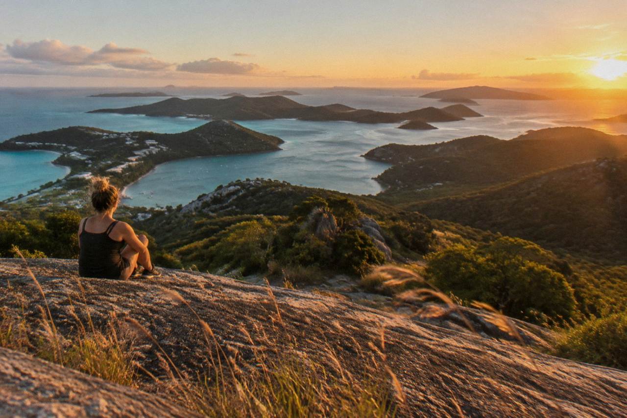 Turquoise water and green islands seen from a headland above the Whitsunday coast