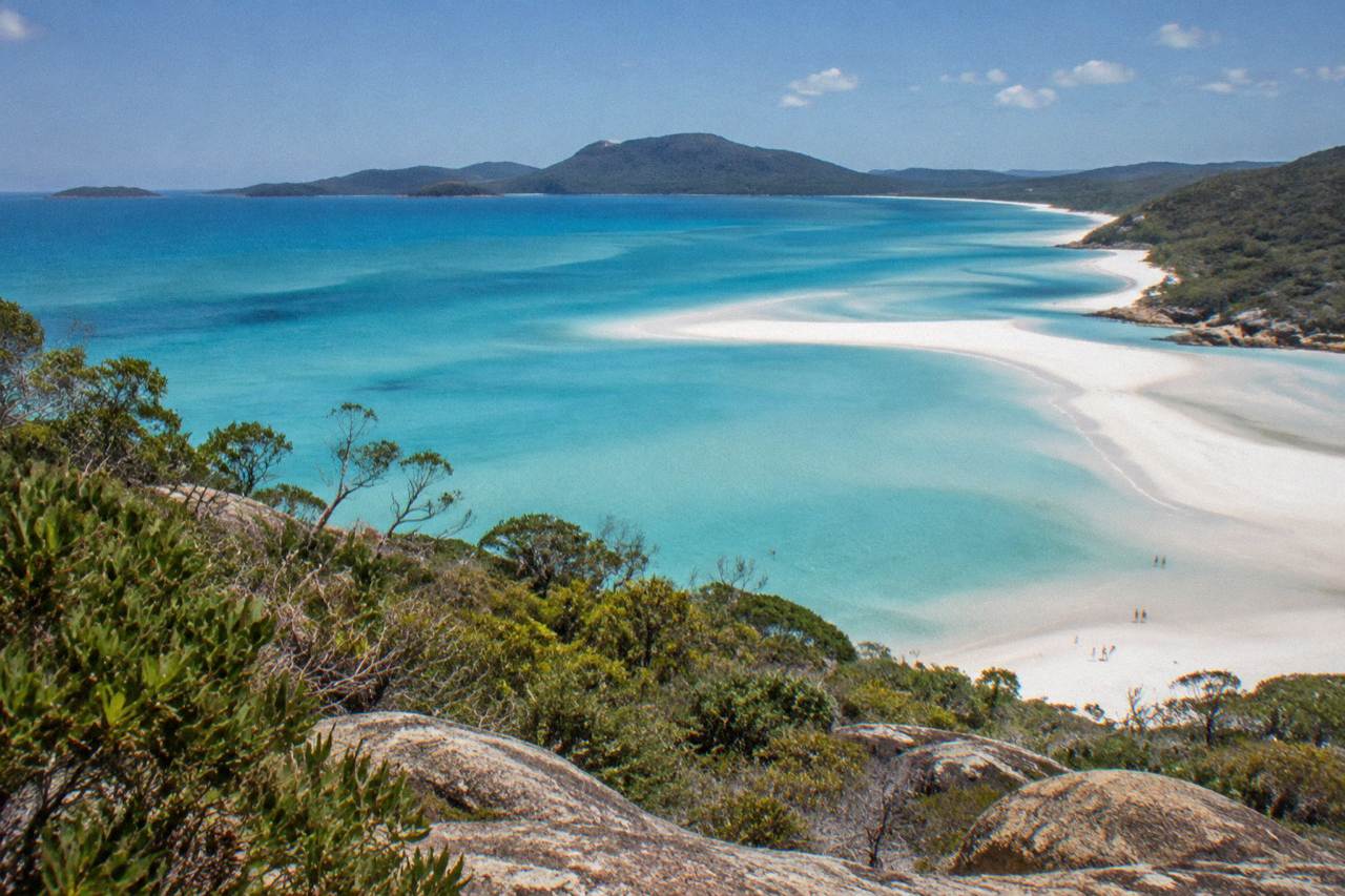 White silica sand and turquoise inlet water at Whitehaven Beach seen from a headland