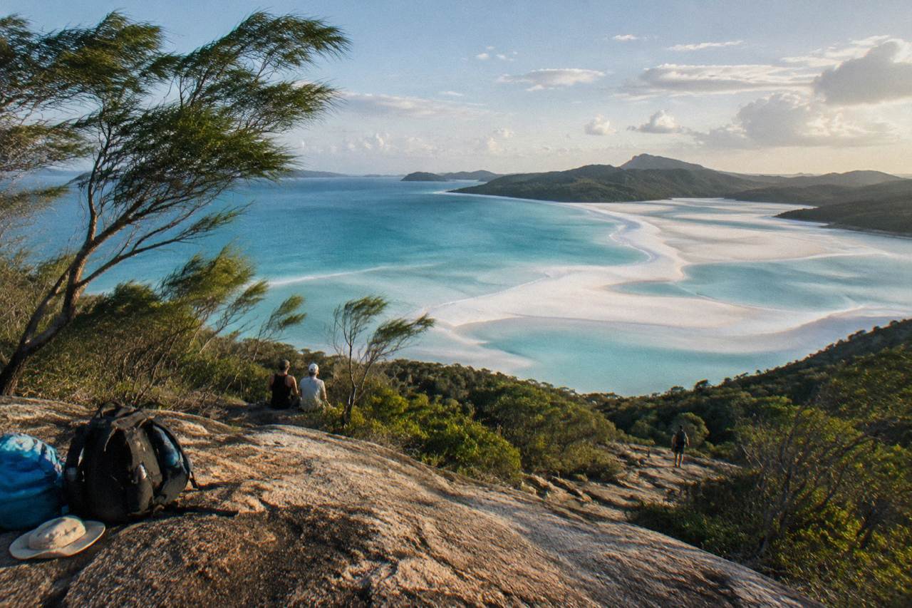 Whitehaven Beach sweeping white sand and turquoise water seen from a headland