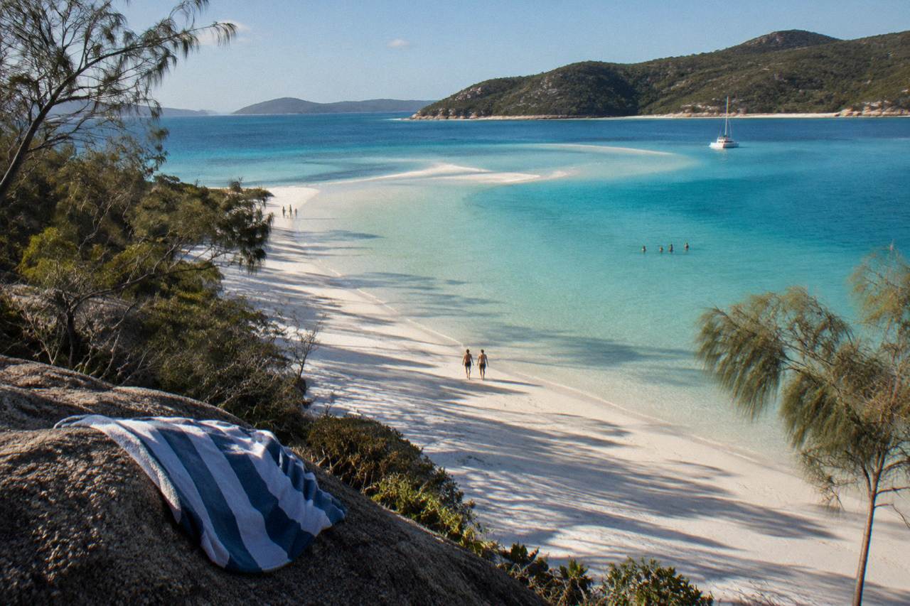 White silica sand and turquoise inlet water at Whitehaven Beach seen from a headland